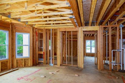 new-construction-wood-home-framing-abstract-new-construction-home-framing-e1600423536358.jpg